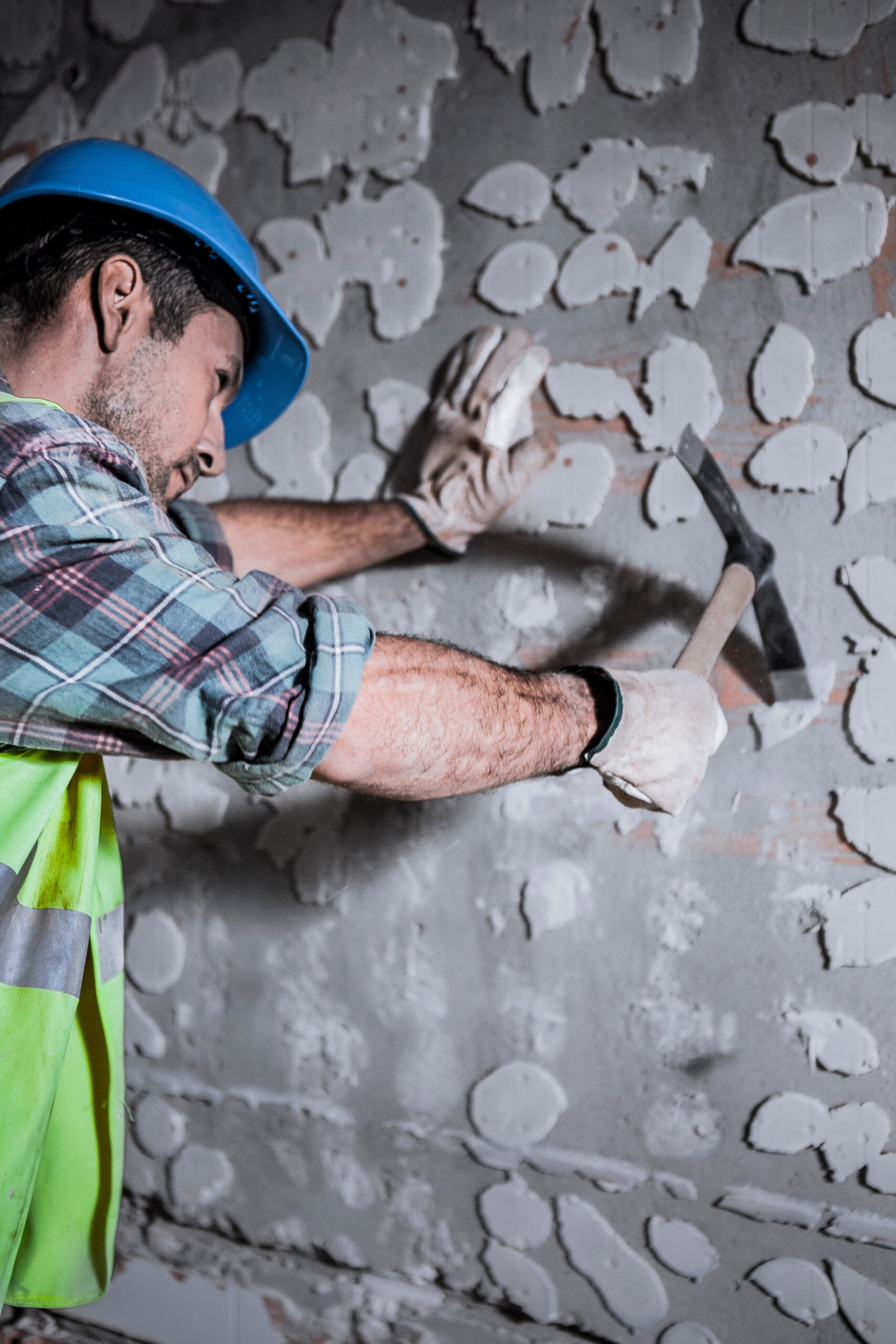 a-worker-with-a-helmet-on-his-head-hits-a-wall-wit-2025-01-07-10-31-40-utc a-worker-with-a-helmet-on-his-head-hits-a-wall-wit-2025-01-07-10-31-40-utc